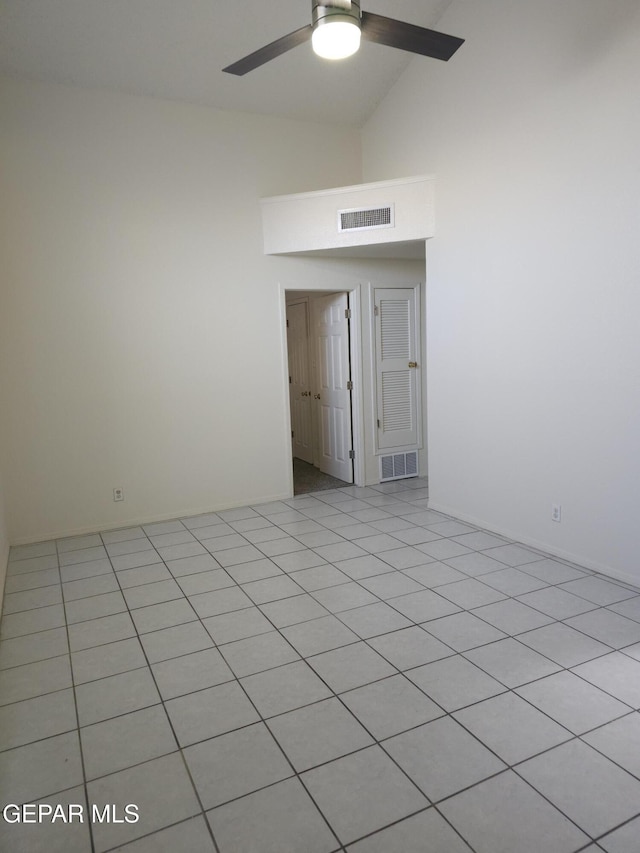 empty room with beam ceiling, a ceiling fan, visible vents, and high vaulted ceiling