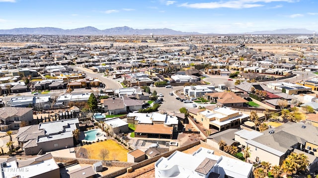 birds eye view of property featuring a mountain view and a residential view