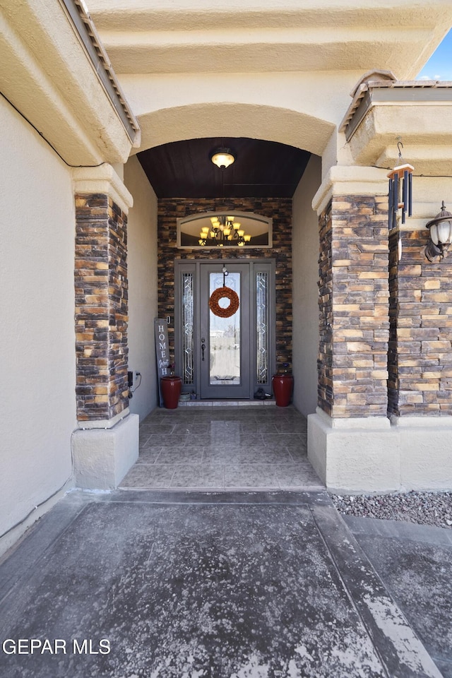 entrance to property with stone siding