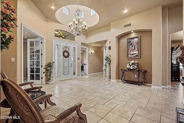 entrance foyer with visible vents, recessed lighting, light tile patterned floors, baseboards, and a chandelier