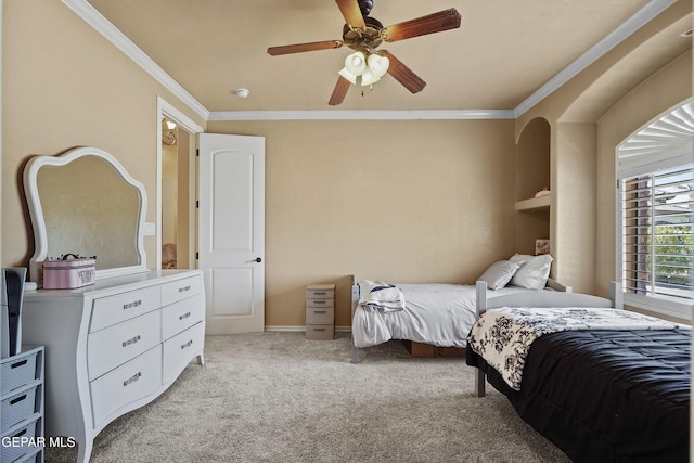 bedroom featuring baseboards, light carpet, ceiling fan, and crown molding