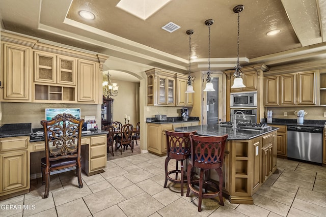 kitchen featuring visible vents, open shelves, a tray ceiling, a sink, and appliances with stainless steel finishes