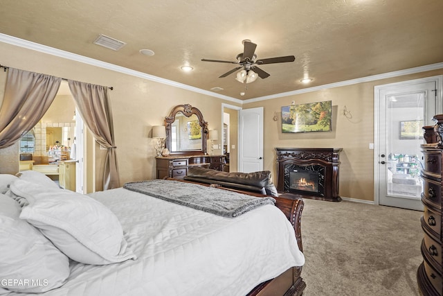 bedroom with access to exterior, visible vents, crown molding, carpet floors, and a warm lit fireplace