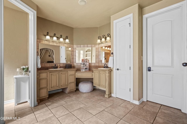 full bathroom with tile patterned flooring, double vanity, and a sink