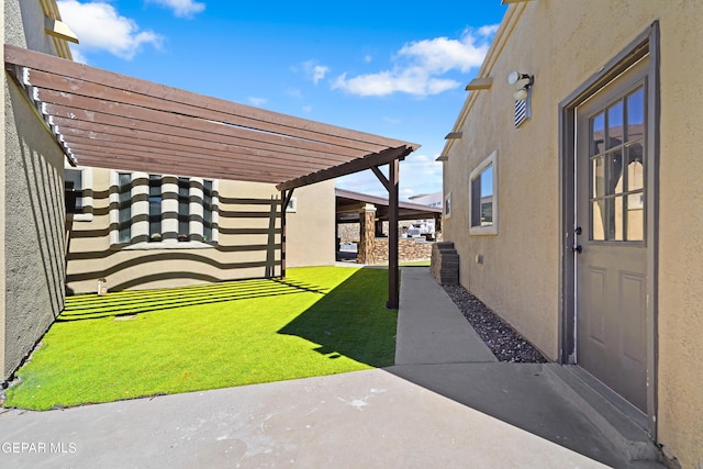 view of yard with a pergola and a patio