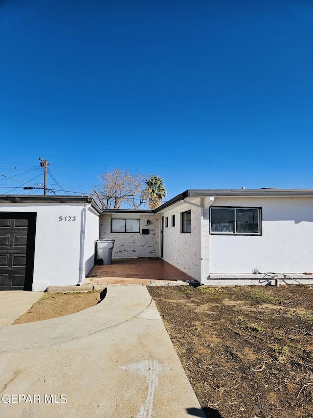 view of property exterior with stucco siding