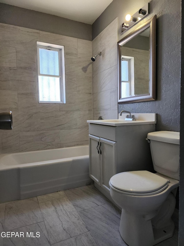 full bathroom featuring shower / bath combination, toilet, and vanity