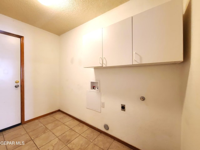 laundry room featuring baseboards, washer hookup, cabinet space, electric dryer hookup, and a textured ceiling