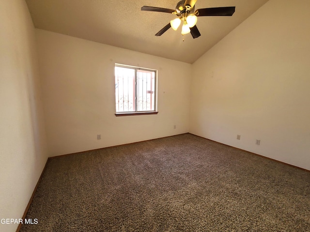 unfurnished room with lofted ceiling, baseboards, carpet floors, and ceiling fan