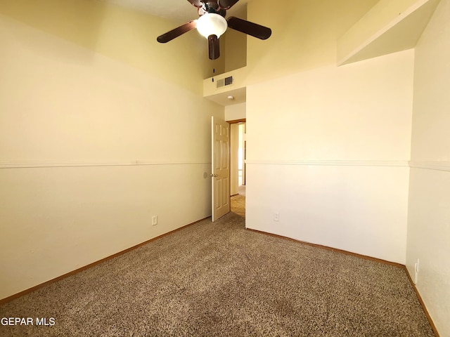 spare room with visible vents, baseboards, carpet, and ceiling fan