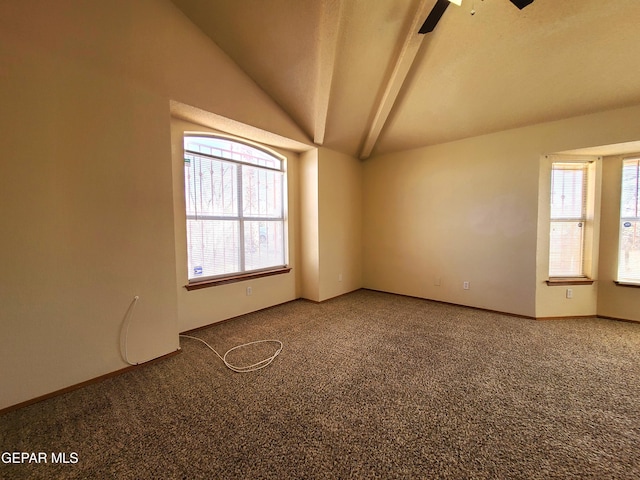 spare room featuring baseboards, plenty of natural light, carpet floors, and vaulted ceiling with beams