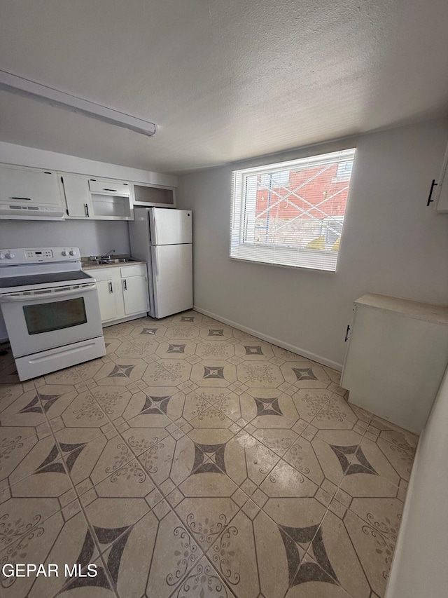 kitchen featuring a textured ceiling, white cabinetry, ventilation hood, white appliances, and light floors