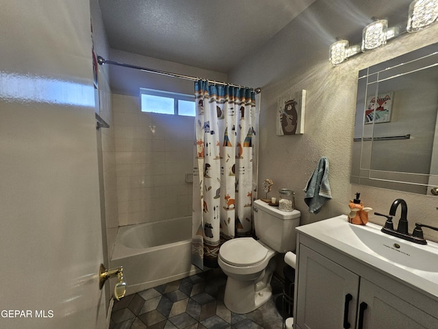 bathroom with vanity, shower / bath combination with curtain, toilet, and a textured wall