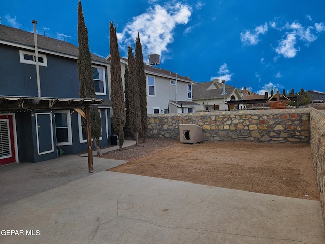 view of yard featuring a patio, a fenced backyard, and a pergola