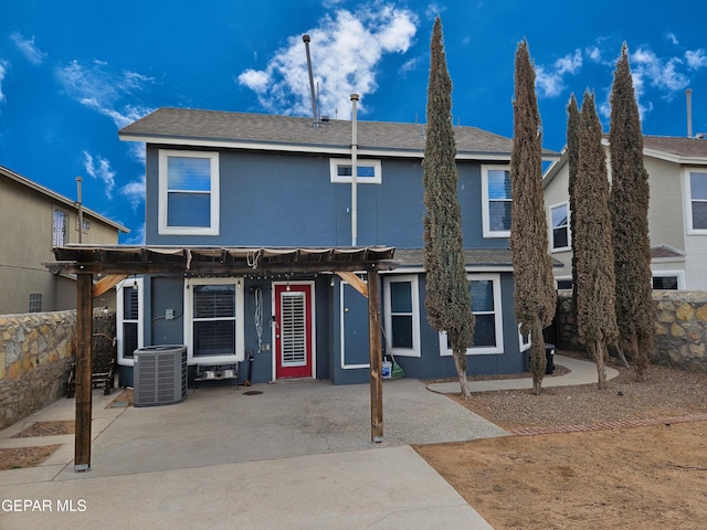 view of front of house featuring stucco siding and central AC