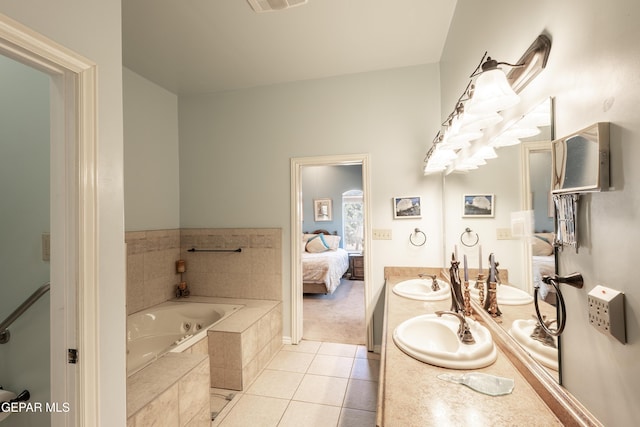 14097 Silver Spur St, El Paso, TX 79938 - bathroom featuring connected bathroom, tile patterned floors, a jetted tub, and double vanity