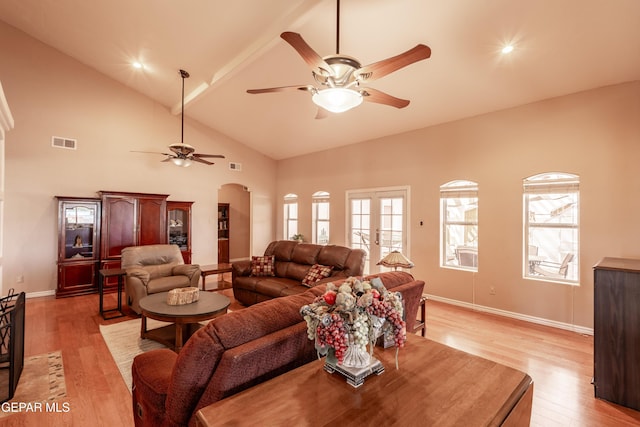 14097 Silver Spur St, El Paso, TX 79938 - living room with ceiling fan, light wood-type flooring, arched walkways, high vaulted ceiling, and baseboards