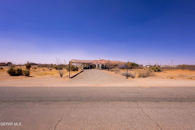 14097 Silver Spur St, El Paso, TX 79938 - view of yard featuring driveway