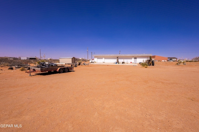 14097 Silver Spur St, El Paso, TX 79938 - view of yard with a detached garage