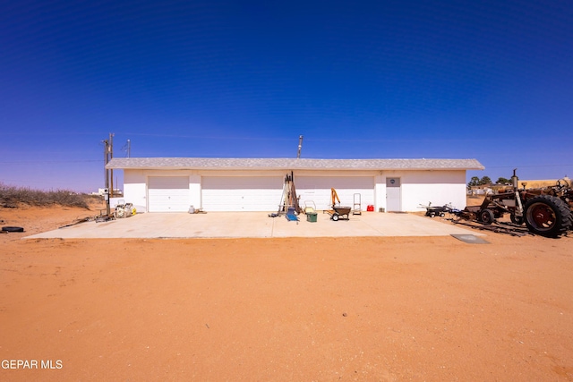 14097 Silver Spur St, El Paso, TX 79938 - view of front of house with driveway, a detached garage, and stucco siding