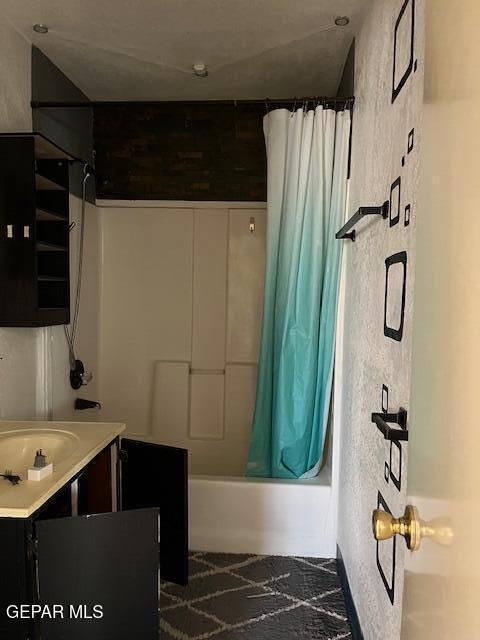 full bathroom featuring shower / tub combo with curtain and vanity