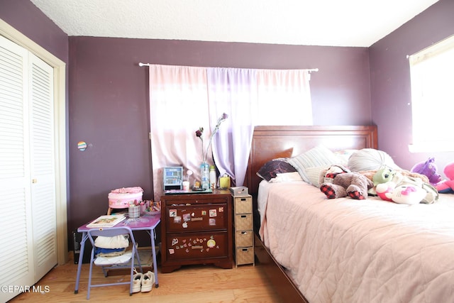 bedroom with wood finished floors