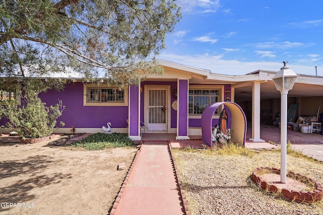 single story home featuring stucco siding