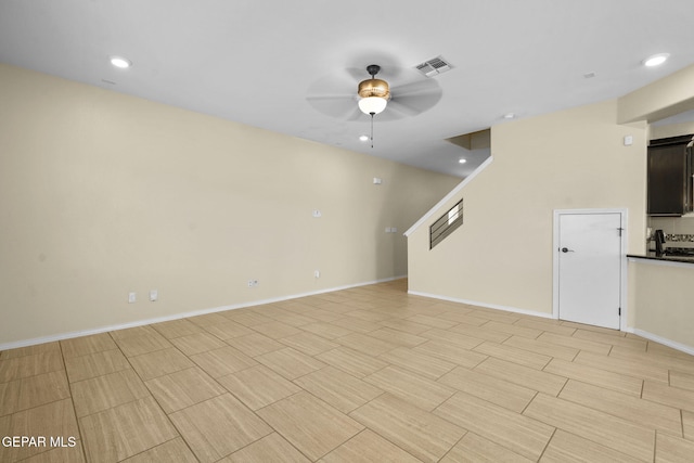 unfurnished living room featuring recessed lighting, baseboards, visible vents, and ceiling fan