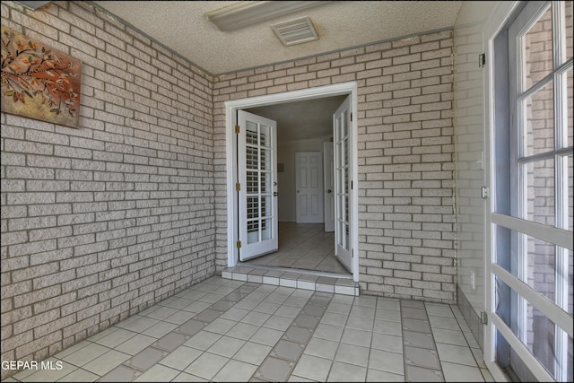 property entrance with visible vents