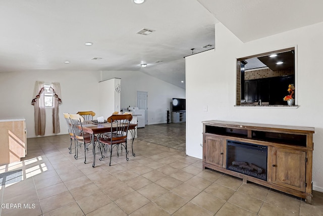 dining space featuring light tile patterned flooring, visible vents, recessed lighting, and vaulted ceiling