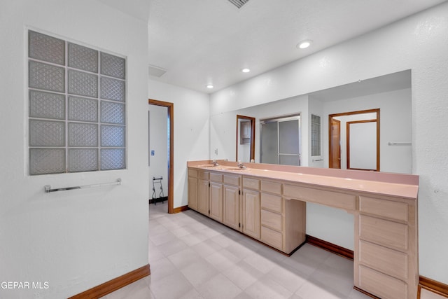 bathroom with vanity, tile patterned floors, recessed lighting, and baseboards