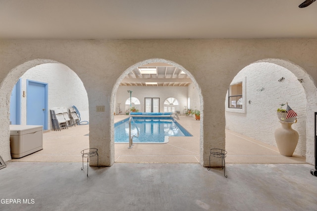 view of swimming pool featuring a swimming pool and a patio