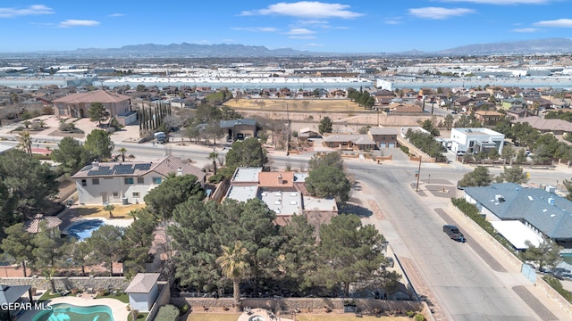 birds eye view of property with a mountain view and a residential view