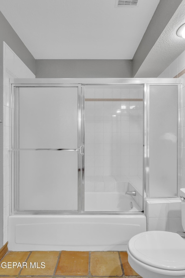 full bath with enclosed tub / shower combo, visible vents, tile patterned floors, and toilet