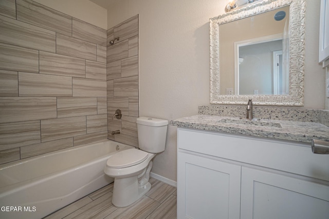 full bathroom with vanity, baseboards, wood tiled floor, tub / shower combination, and toilet