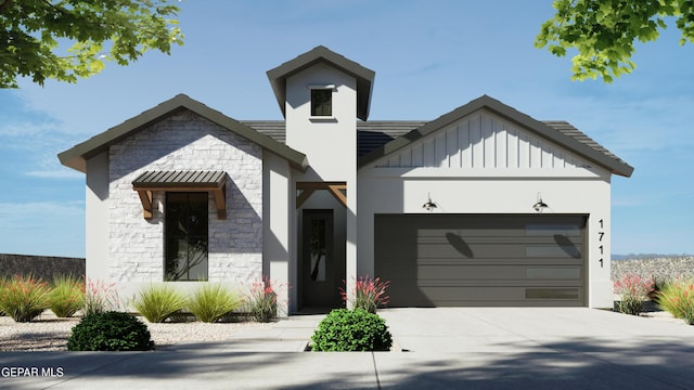 view of front of home featuring board and batten siding, stone siding, a garage, and driveway