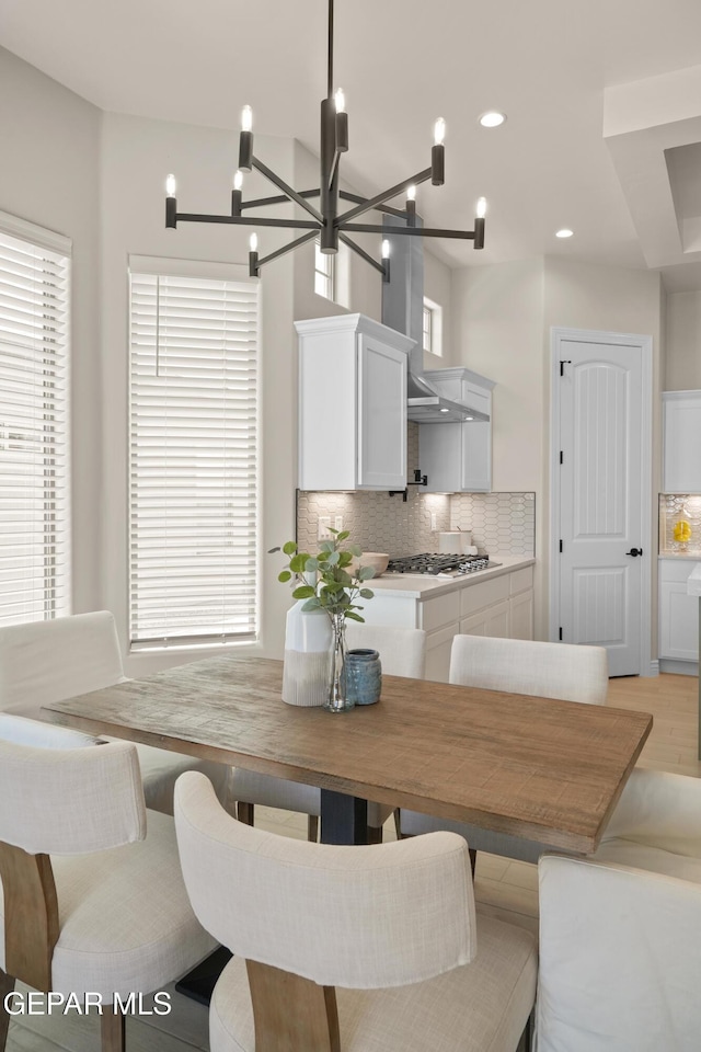 dining space featuring plenty of natural light, recessed lighting, and light wood-style floors