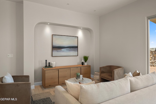 living room with light wood finished floors and baseboards