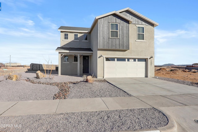 view of front facade featuring stucco siding, board and batten siding, concrete driveway, and an attached garage