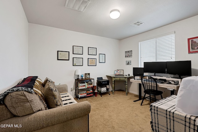 office area featuring light colored carpet and visible vents