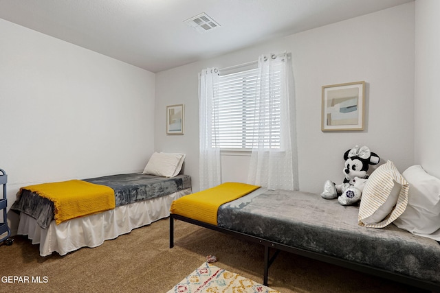 bedroom featuring visible vents and carpet