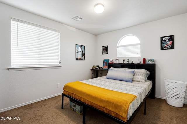 bedroom featuring baseboards, visible vents, and carpet floors