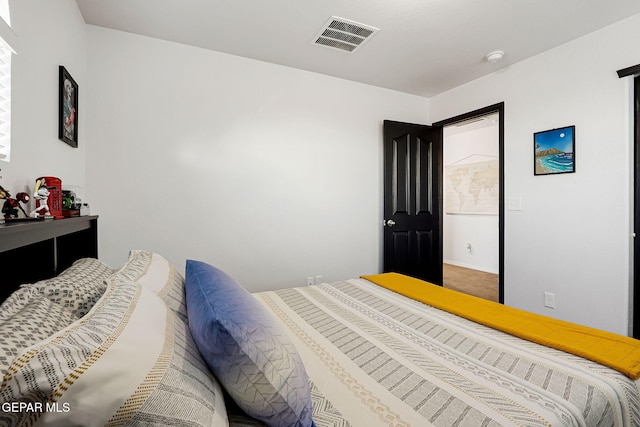 bedroom featuring visible vents