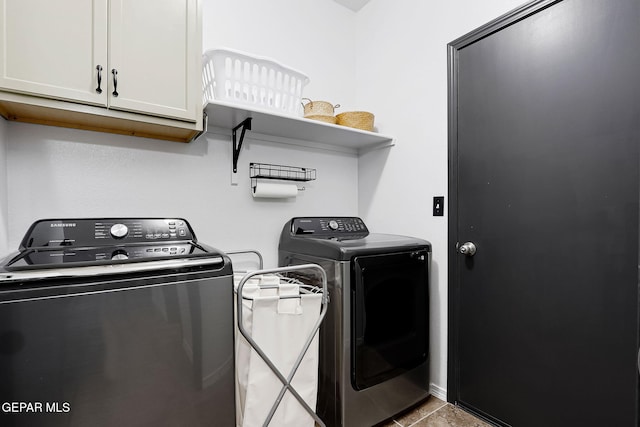 laundry area with cabinet space and independent washer and dryer