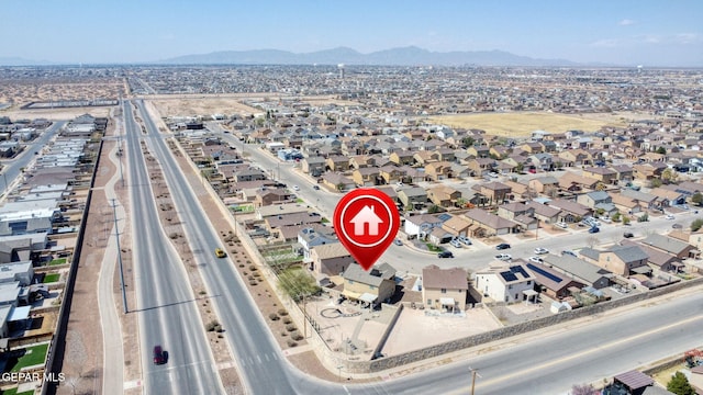 drone / aerial view featuring a mountain view and a residential view