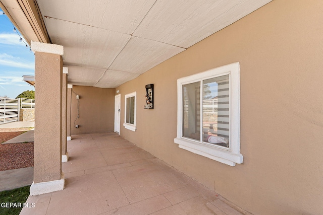 view of patio / terrace featuring fence