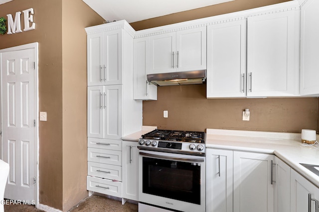 kitchen with under cabinet range hood, white cabinets, light countertops, and stainless steel range with gas cooktop