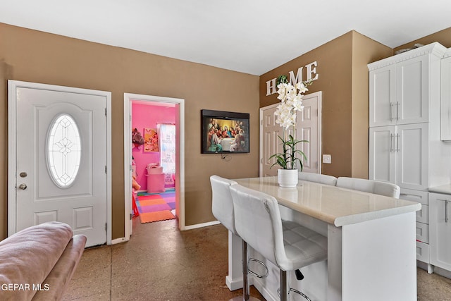 dining space with baseboards