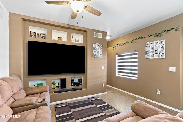 living area featuring baseboards, visible vents, and ceiling fan