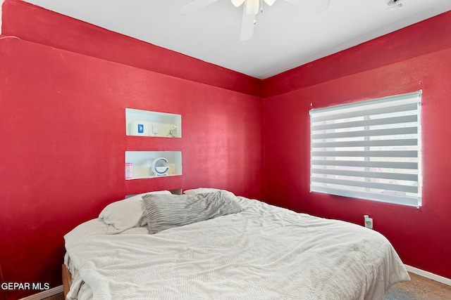 bedroom with baseboards and ceiling fan